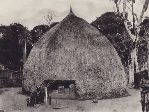 M484591_Witch-doctor-outside-his-hut-with-minkisi-fetishes-Belgian-Congo